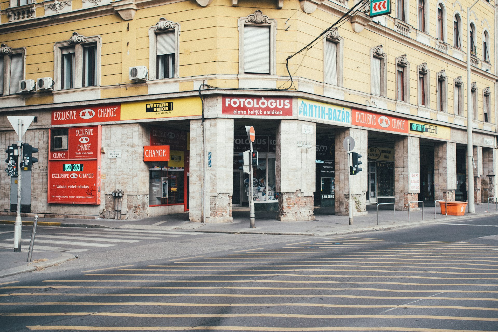 an empty street in front of a building